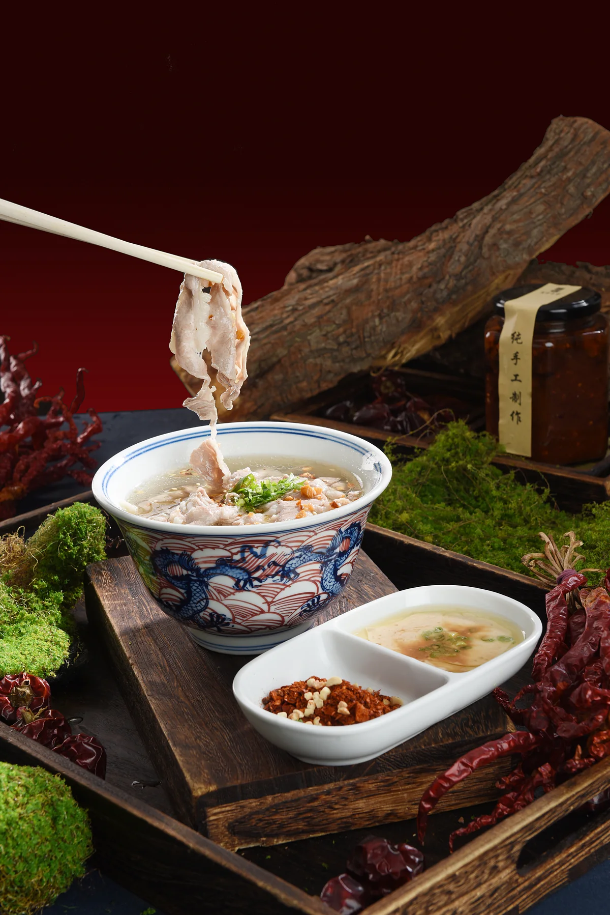 Qiaojiao beef in a patterned porcelain bowl with dipping spices